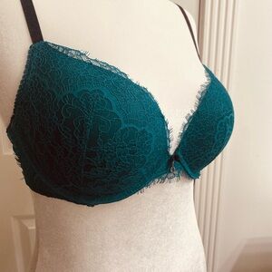Emerald green bra with black straps. Size 38C.